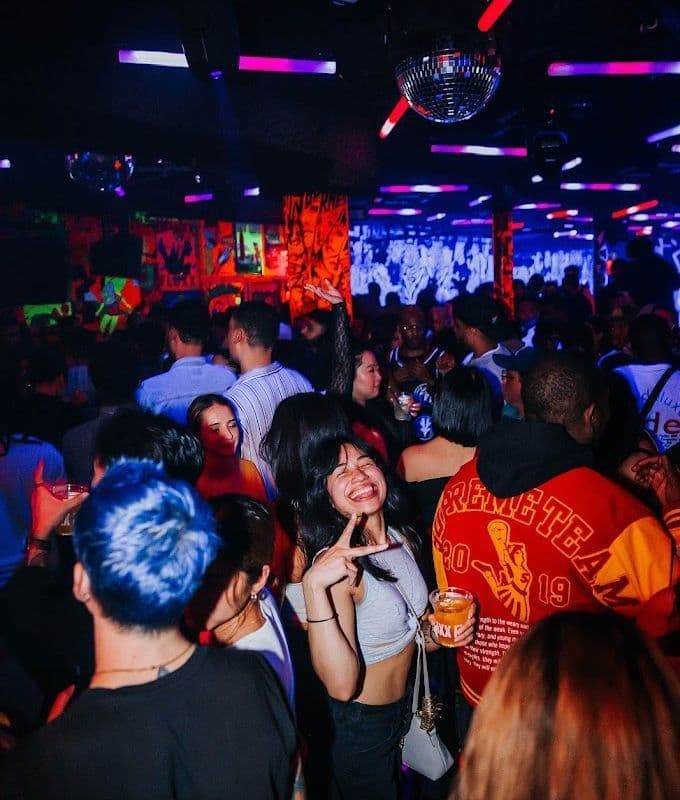 Neon blacklight art and arcade room at Deluxx Fluxx in the East Village